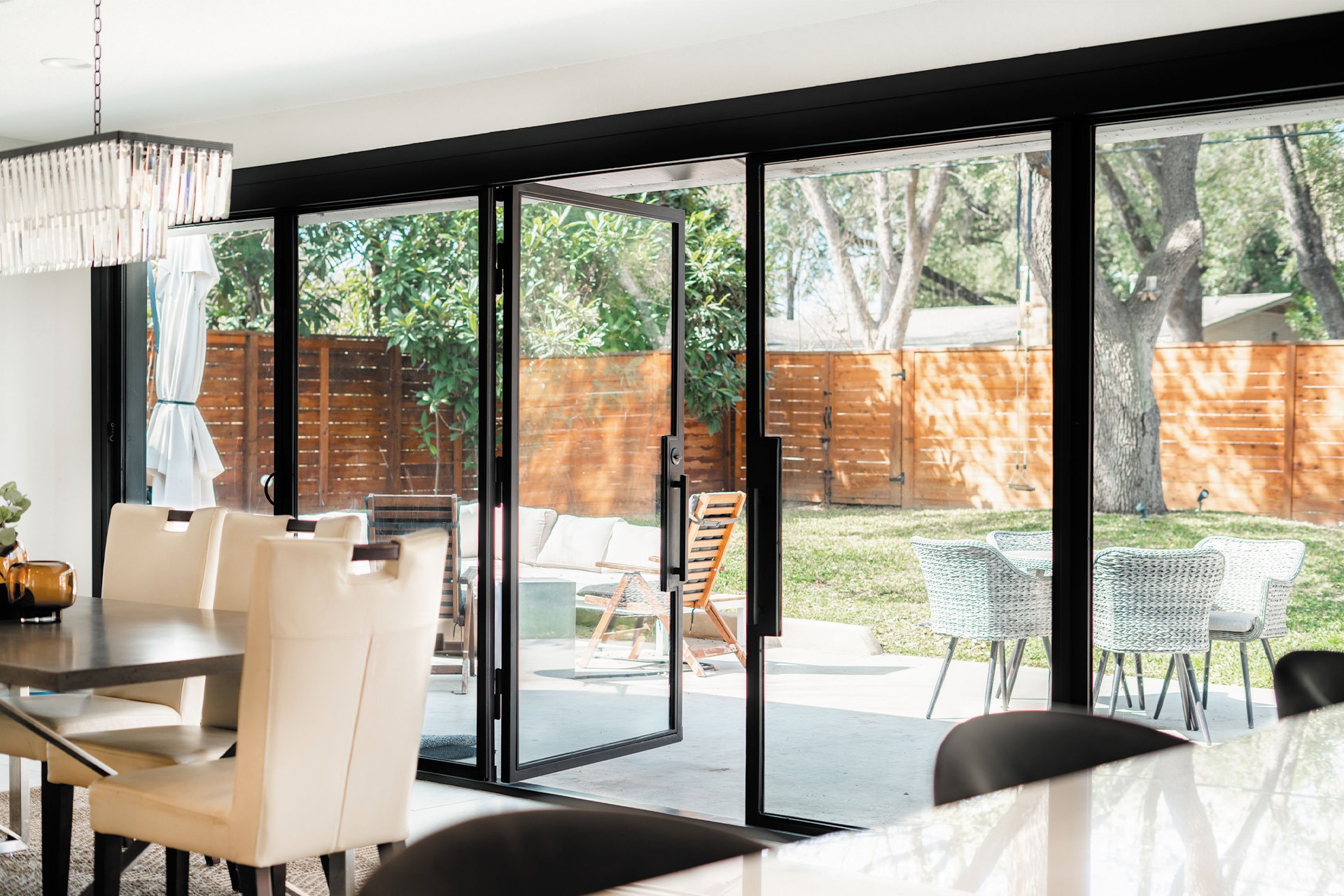 Multi panel steel sliding door system