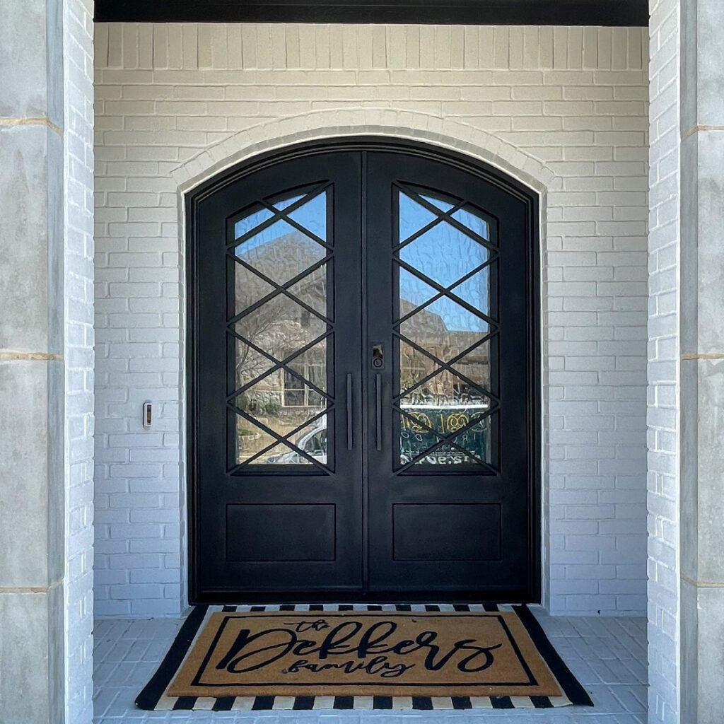 Elegant custom iron door on Texas home exterior
